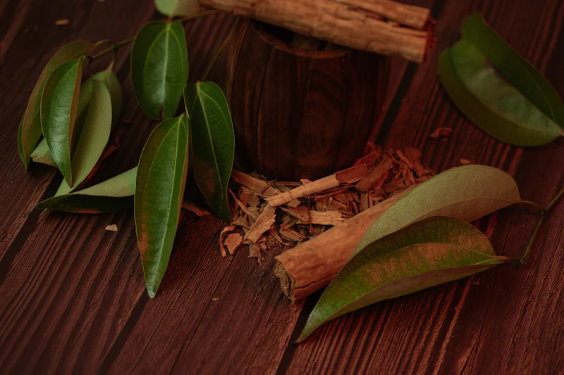 Cinnamon and herbs on a wooden table