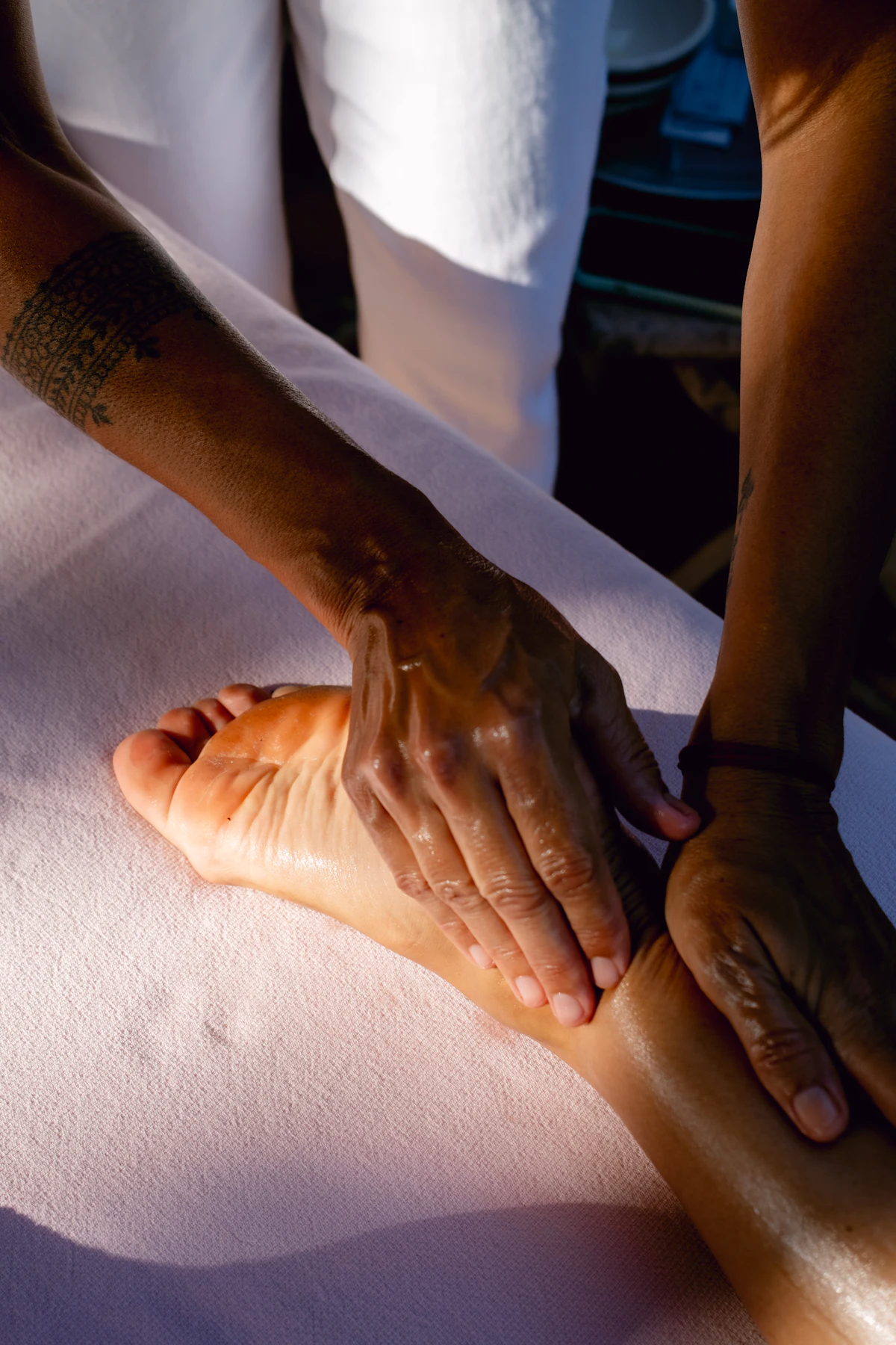 Therapist giving a Panchakarma massage at a patient's home